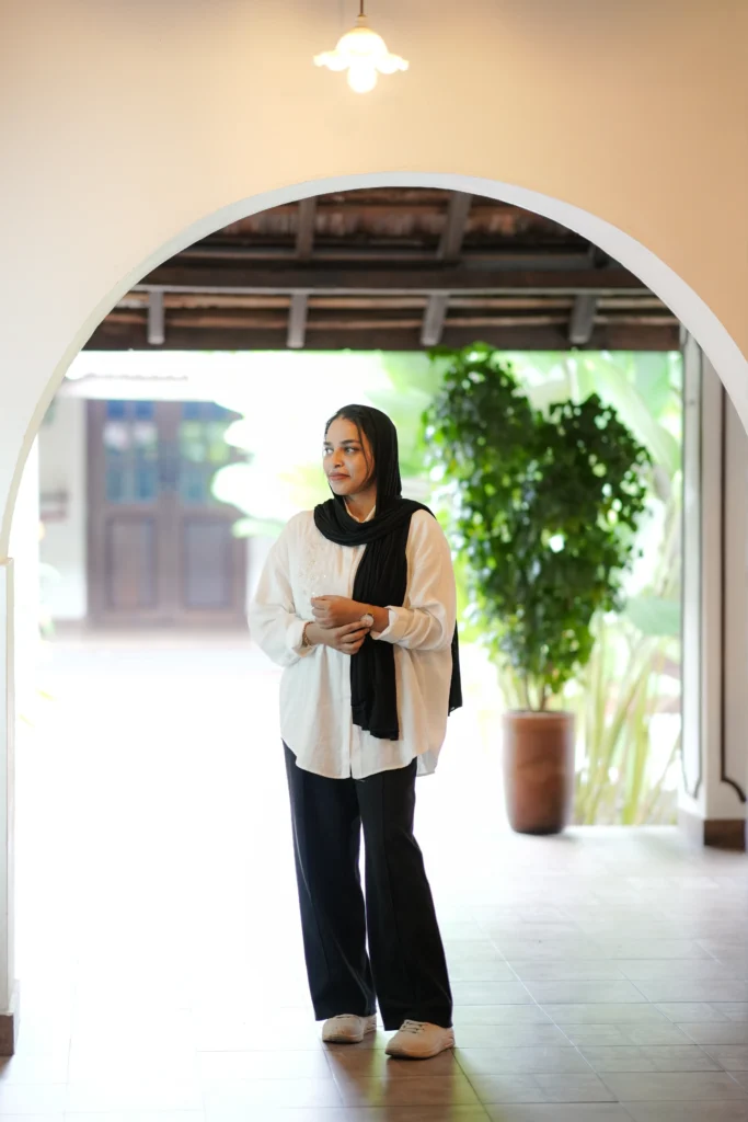 freelance digital marketing analyst in calicut standing in a professional workspace.